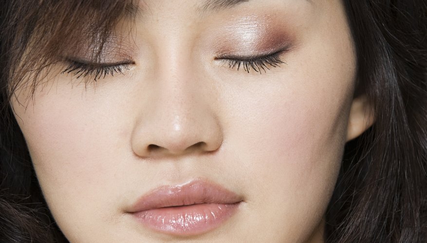 Feathered bangs create a soft effect around the face.