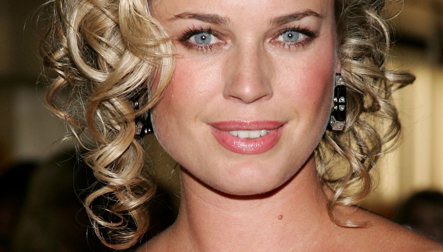Actress Rebecca Romijn sports cute curls at a Prada event.