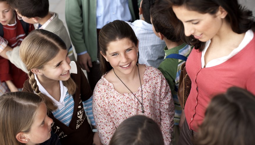 Teacher speaking with children.