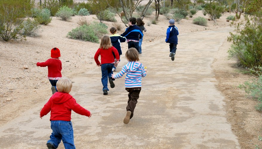 Children running down path