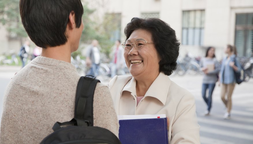 Student speaking with instructor after class.