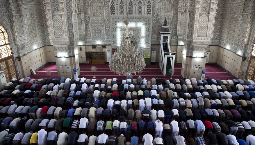 Men pray in a Baghdad mosque