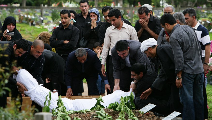 In a Muslim funeral in Australia, the deceased is buried in white cotton shroud, according to custom.