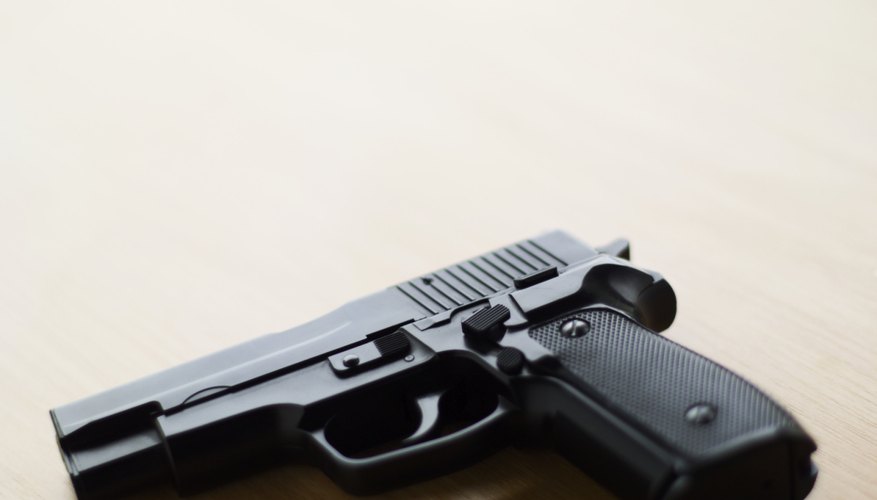 Photo Credit: Stockbyte/Stockbyte/Getty Images Cold bluing technique with handgun