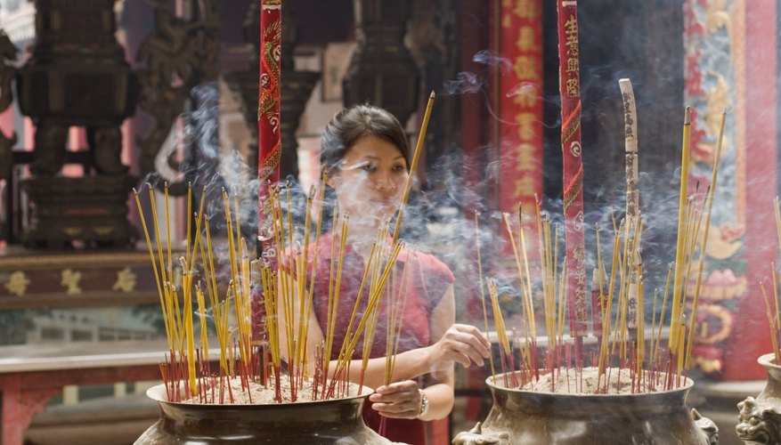 Buddhist incense is burnt to purify the area around the deceased.