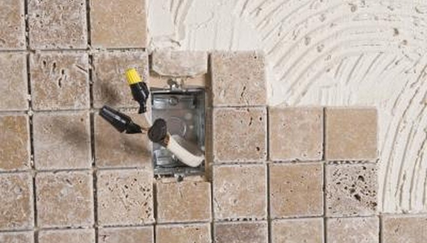 The capped off outlet show here was done so that tile and grout could be installed without the energised outlet in the way.
