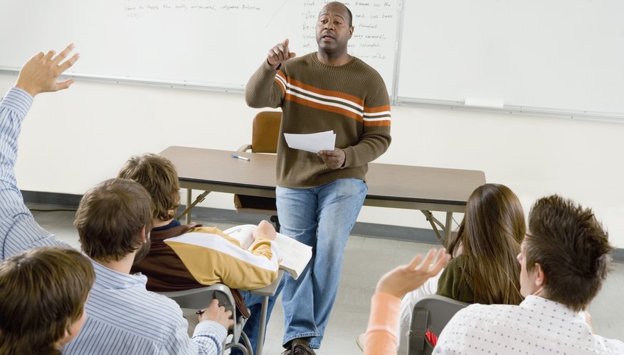 Teaching asking question to student with raised hand.