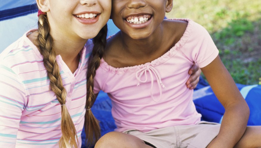 Before a girl starts on a service project, she must earn two badges that count toward the service award.