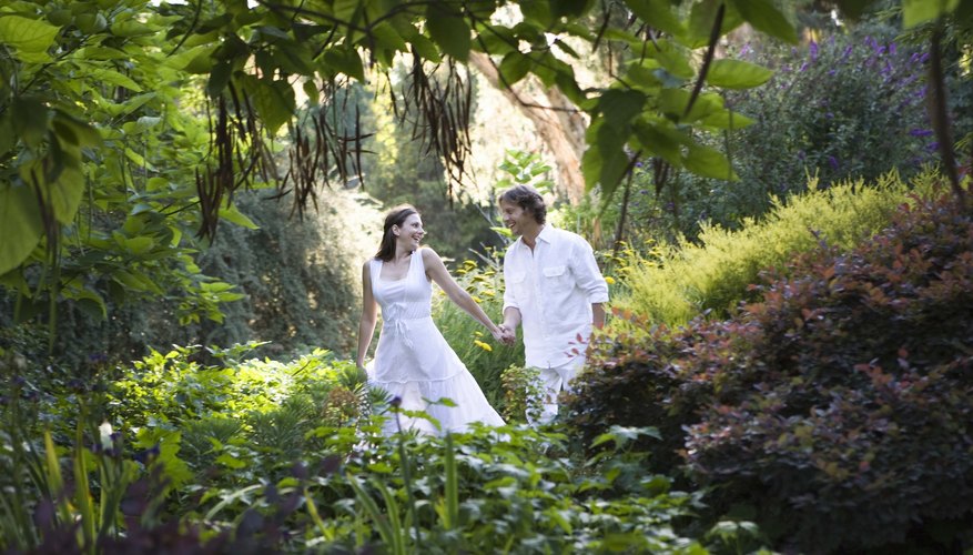 Couple walking through garden