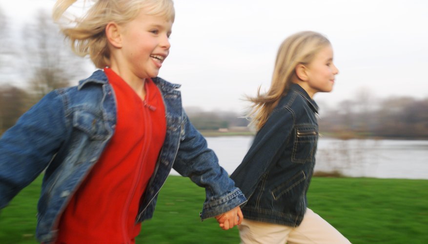 Girls running in grass