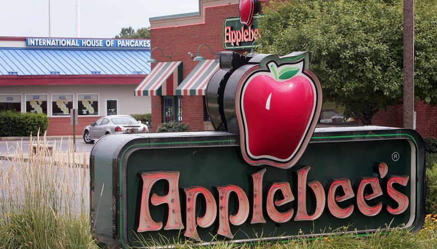 An Applebee's sign in front of a restaurant location