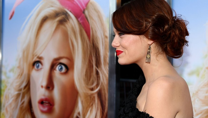 Emma Stone sports a low messy bun at the