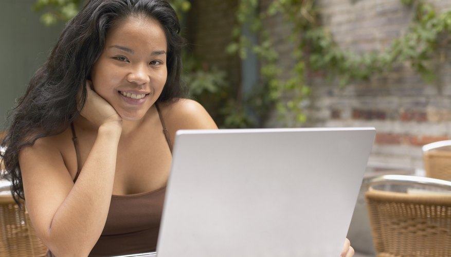 Woman working on laptop computer.