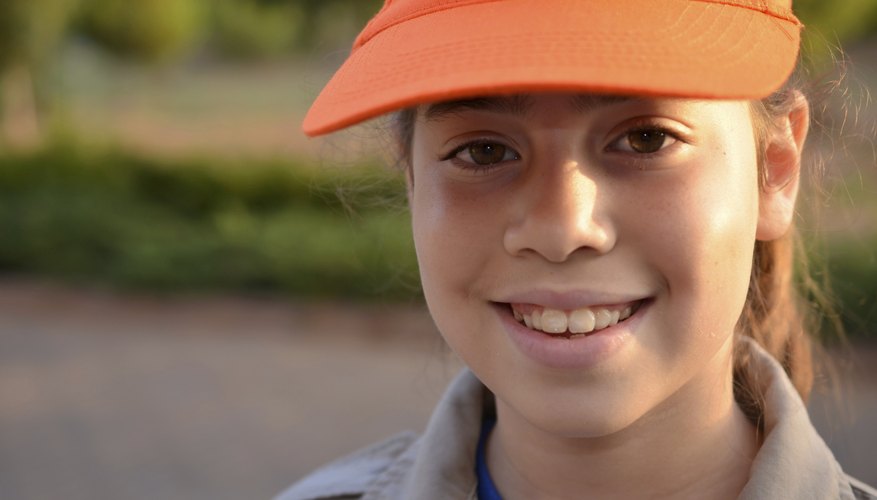 A portrait of a smiling Girl Scout Cadette.