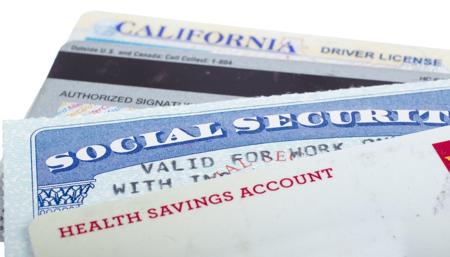 Close-up of a Social Security card, driver's license, and other forms of ID