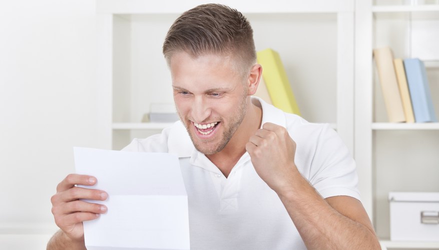 Student reading college letter.