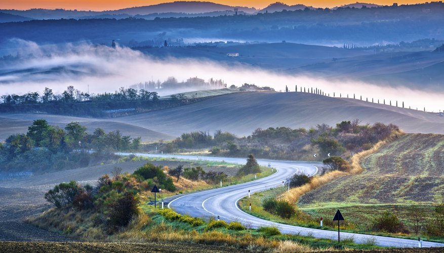 Tuscany foggy landscape at sunrise in Italy