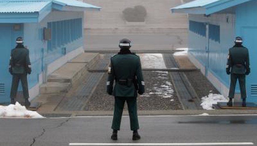 South Korean soldiers guard their side of the Military Demarcation Line which runs through Panmunjom Village in the Korean Demilitarized Zone.