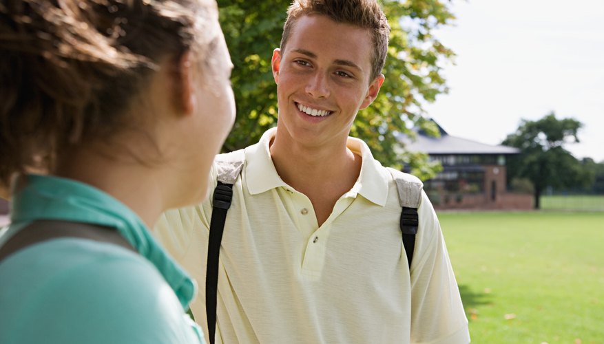 A boy's actions will show that he is attracted to a girl.