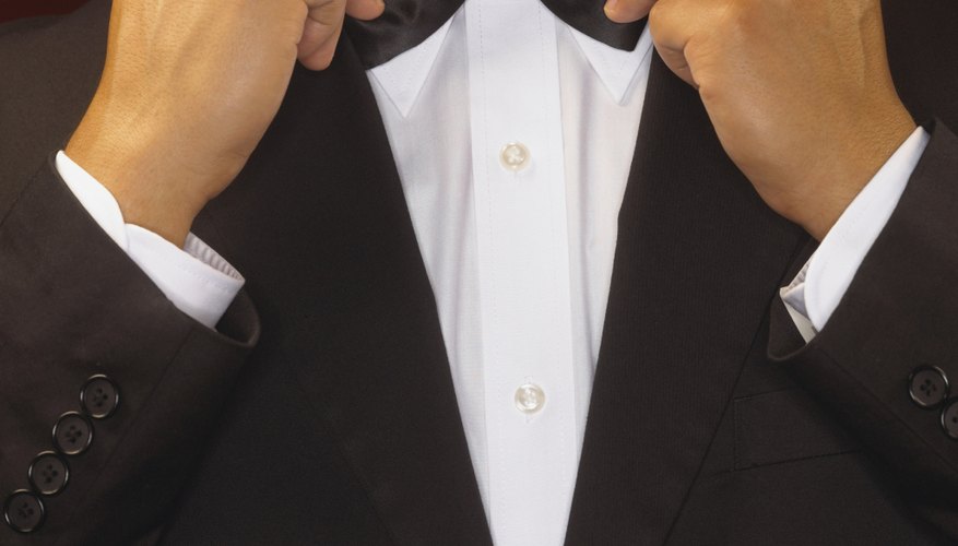 Standard black-tie attire means tuxedos for men and evening gowns for women.