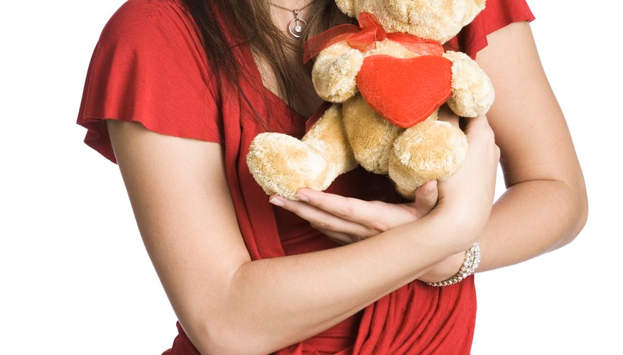 Give her a stuffed animal to cuddle with.