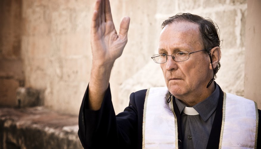 A priest giving a blessing.