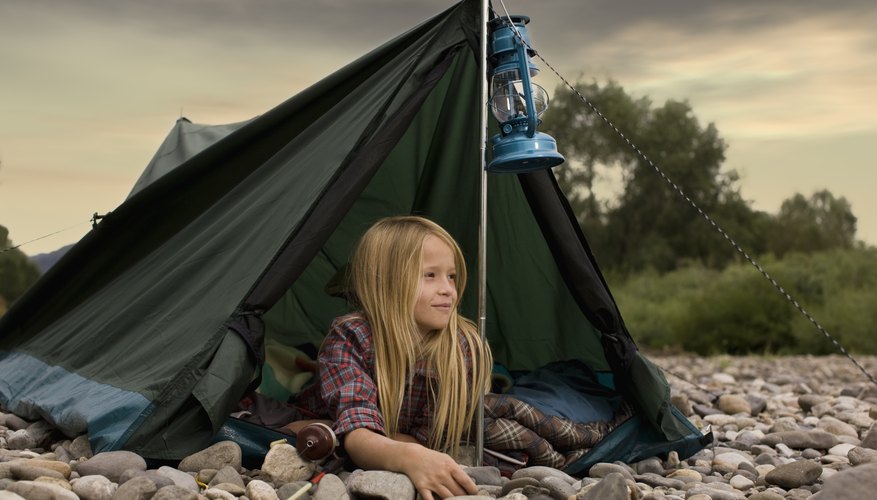 Girl scout looking out of tent