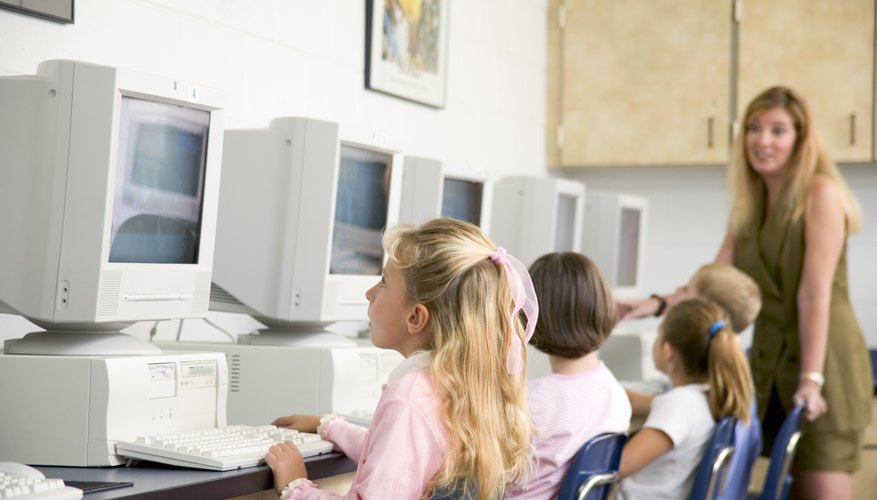 Students learn lessons using computers