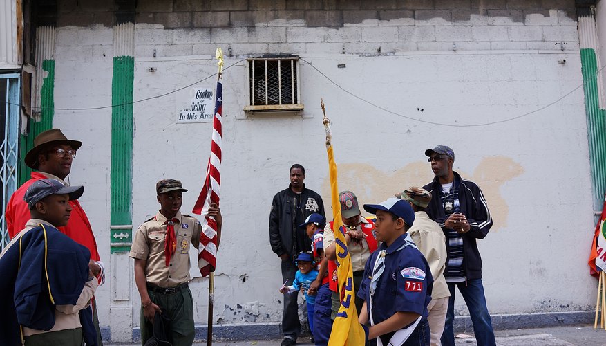 Image of Boy Scouts marching during a parade.