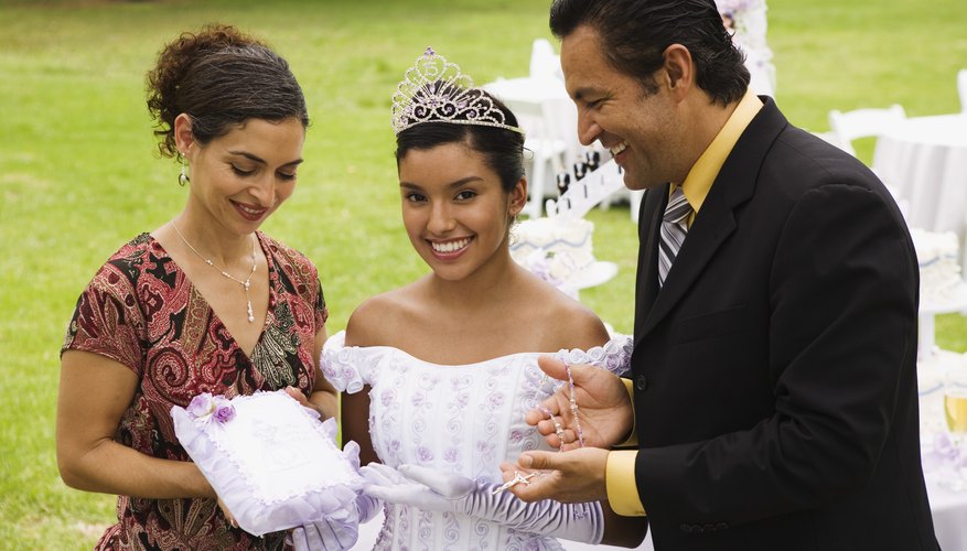 Special gifts for the quinceanera have been blessed by a priest.