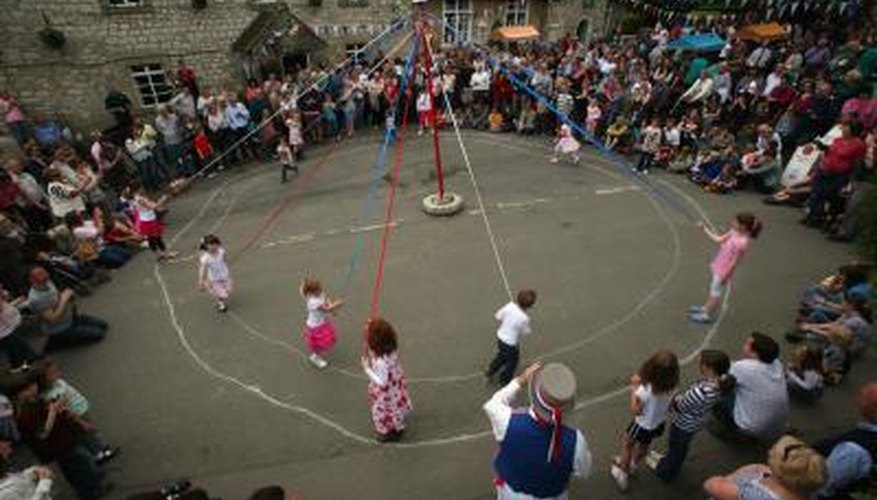 Dancing around a maypole is a popular May Day activity.