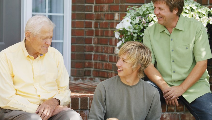 Young man talking to father and grandfather