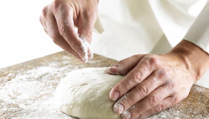 Close Up Of A Baker Kneading Bread Dough In A Metal Mixing Bowl High-Res  Stock Photo - Getty Images