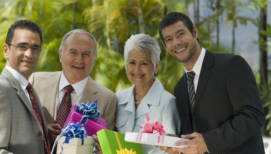 Sons holding gifts for their parents' 35th wedding anniversary.