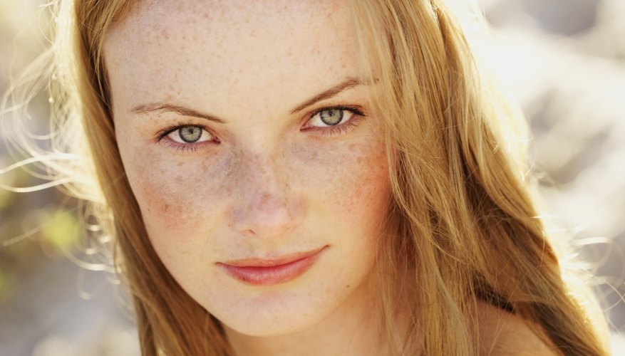 Subtly camouflage your freckles with the right beauty products.