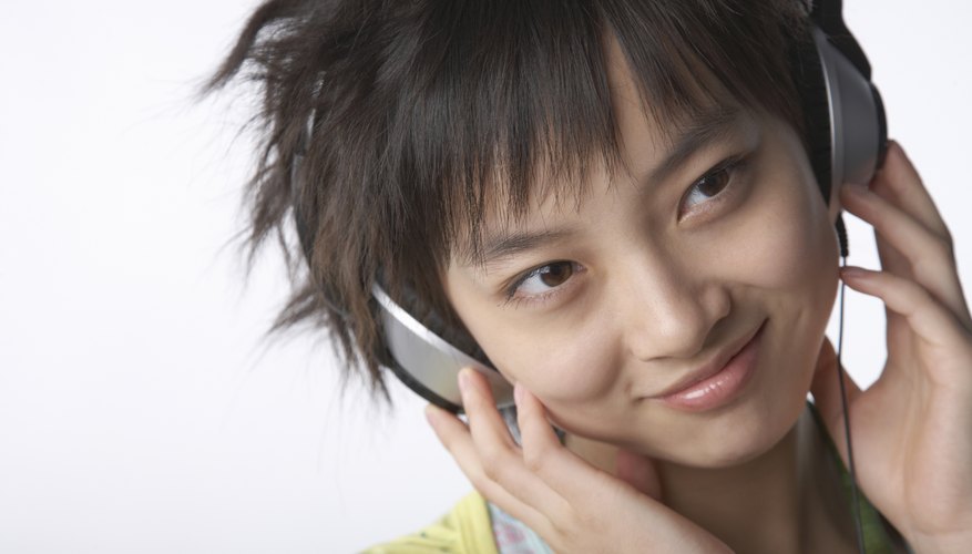 A Chinese teenager listens to music