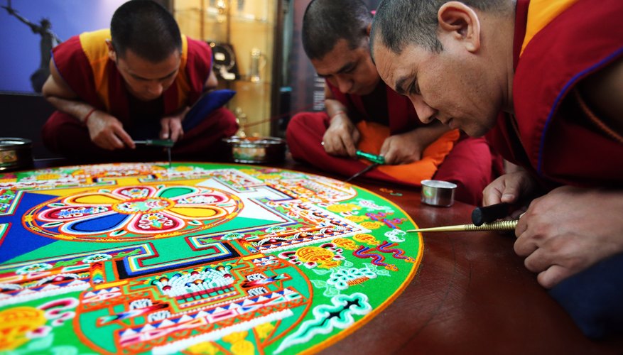 Tibetan monks completing a mandala