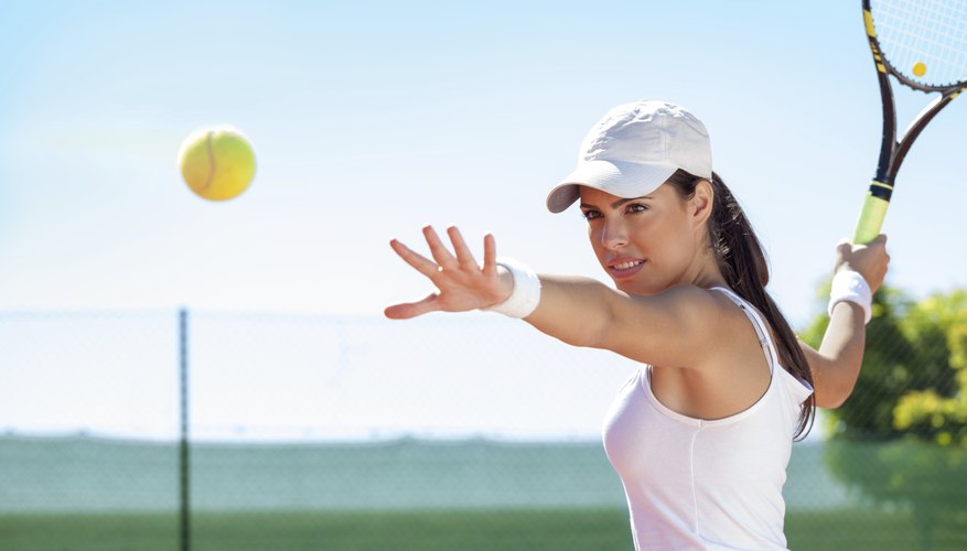 A woman is about to hit a tennis ball.