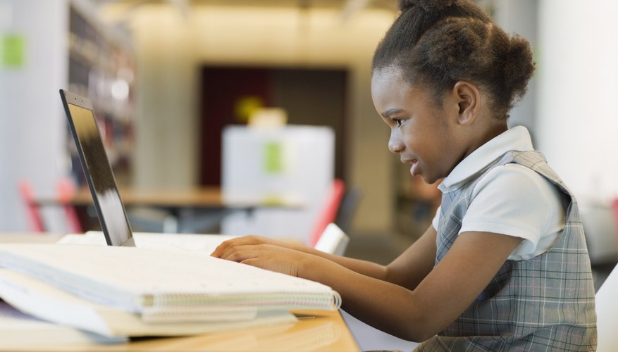 Young student working in classroom.
