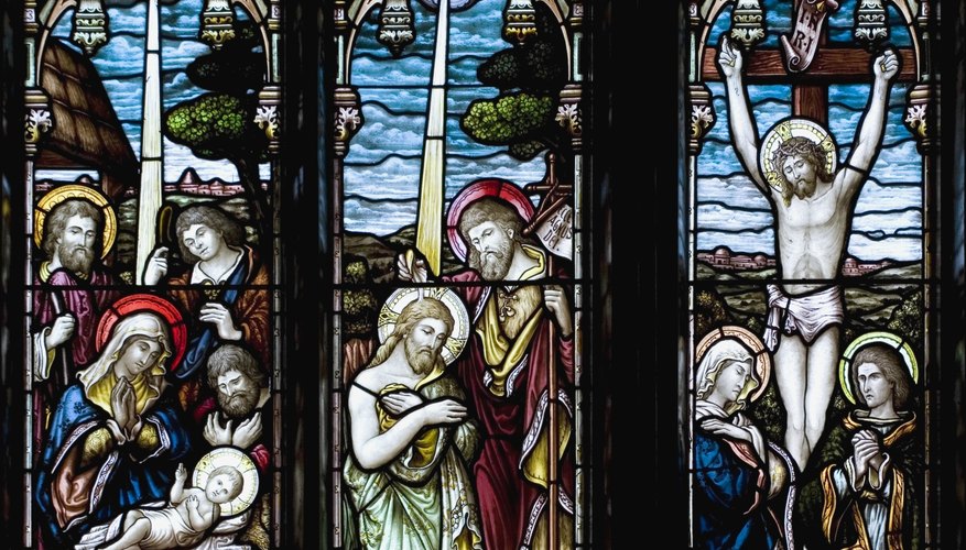 The stained glass scenes often depicted a progression -- in this case from the birth of Christ to his crucifixion.