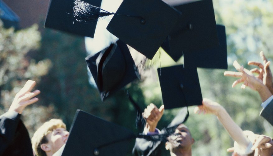 Graduation caps flying in the air
