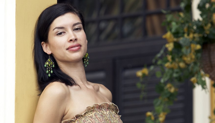 A strapless dress, particularly one with ruffles and ruching, is a flattering choice if you have a small bust.