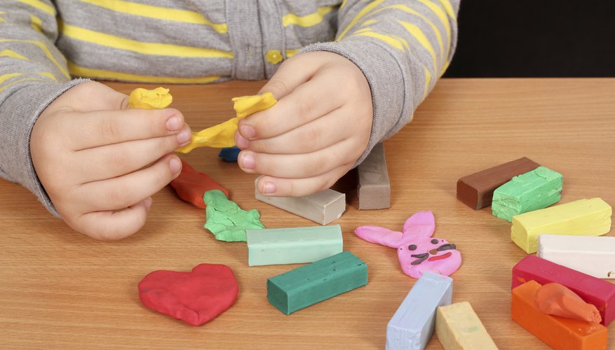 child playing with play dough