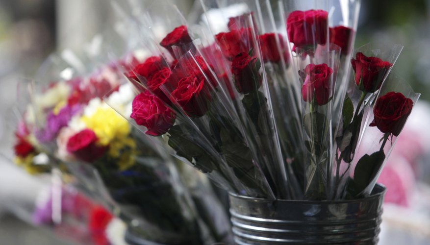 Red roses for sale in a flower shop.