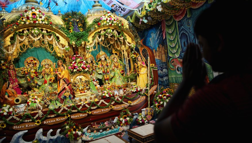 A devotee prays inside a Hindu temple in England.