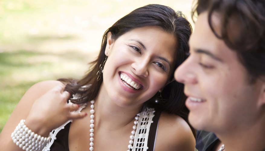 A Mexican couple enjoy a sunny day outdoors together.