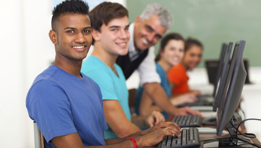 High school students in the computer lab typing.