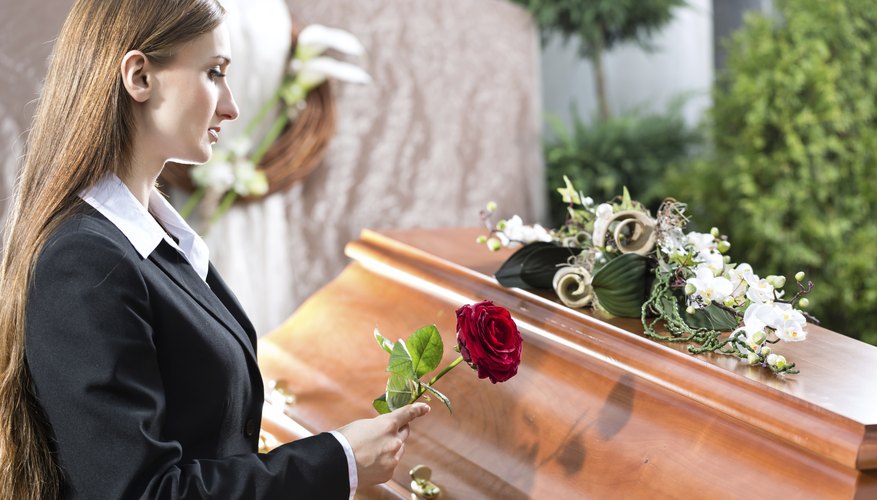 Woman at casket.