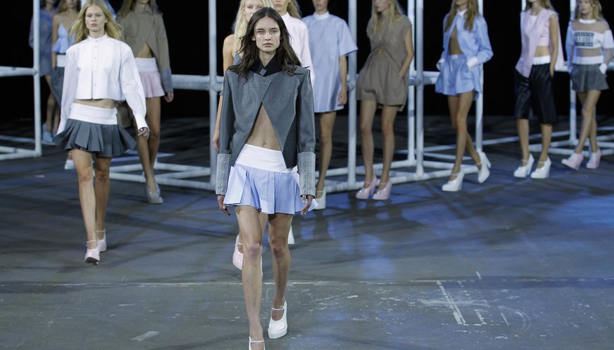 Chunky shoes and a jacket offset super short, pleated miniskirts if you don't wish to flaunt too much skin.
