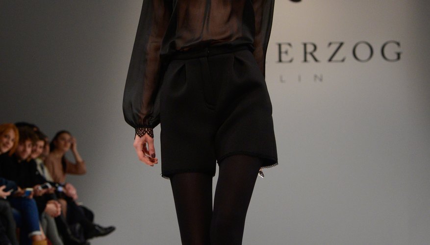 A model struts in high-waisted shorts and tights during fashion week in Berlin, Germany.